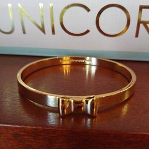 Kate Spade gold tone bangle Take a Bow